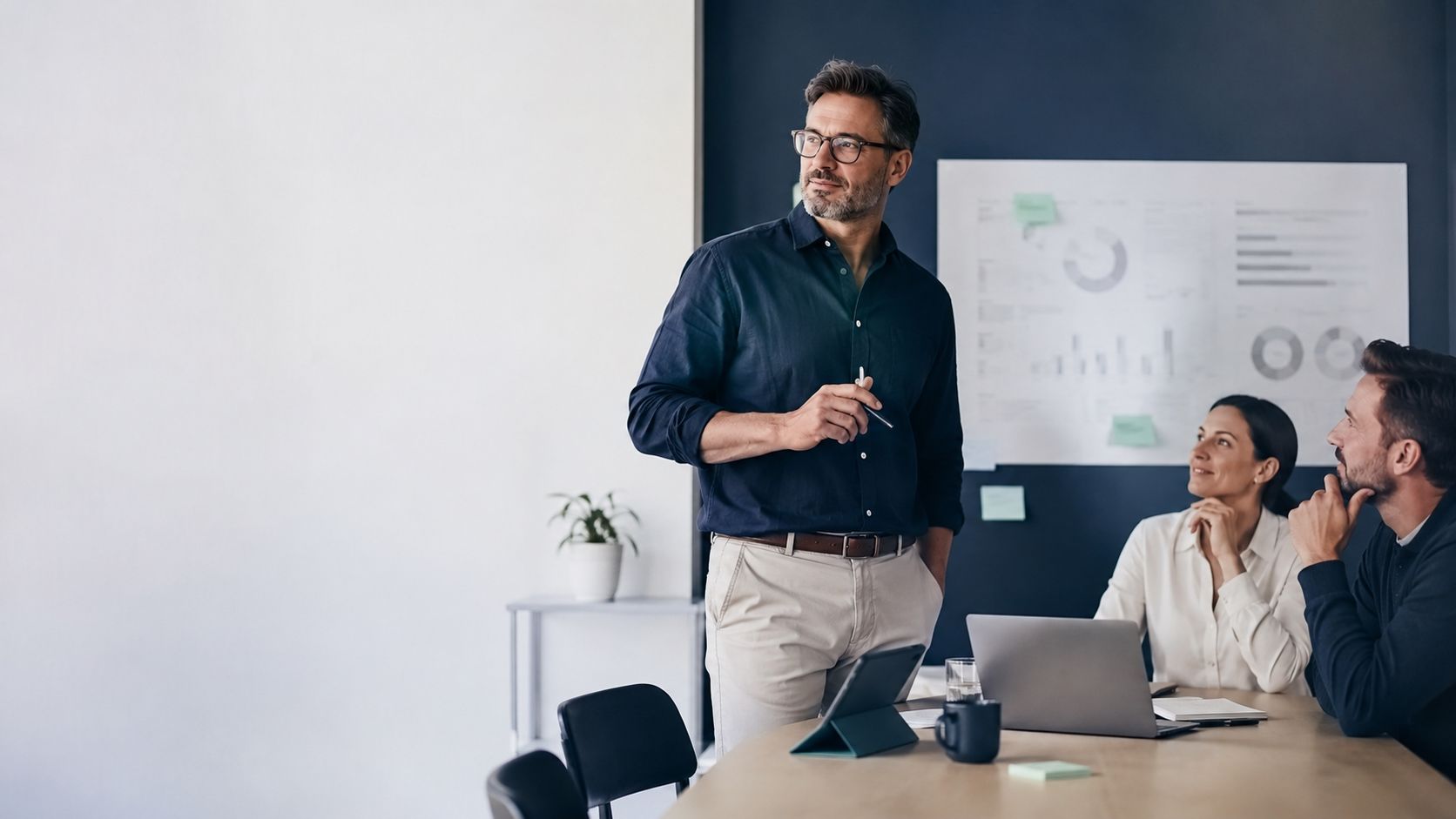Small business owner handling IT on a laptop.
